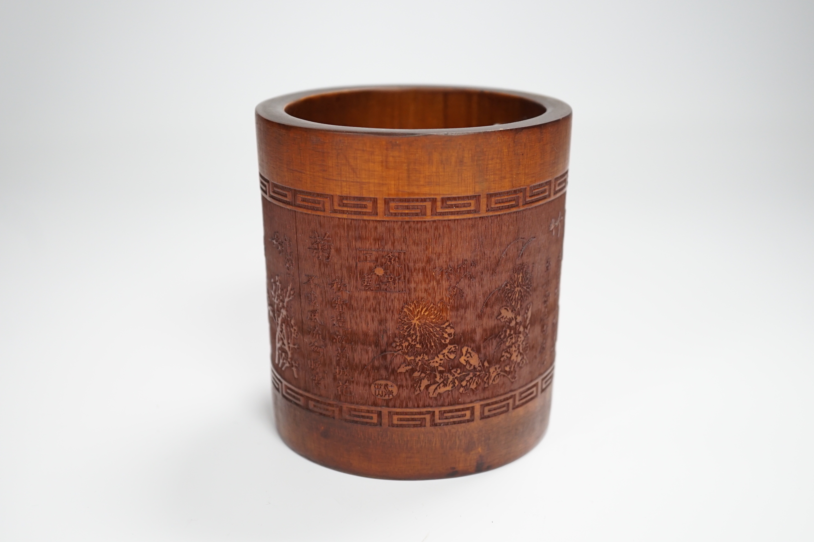 A 20th century bamboo bitong, carved with Chinese characters, bamboo and other foliage, 11.5cm high